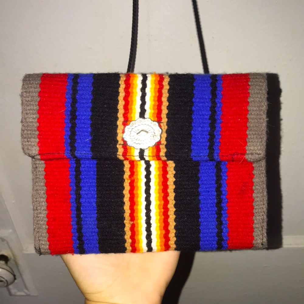 Very small but cute and colorful purse.